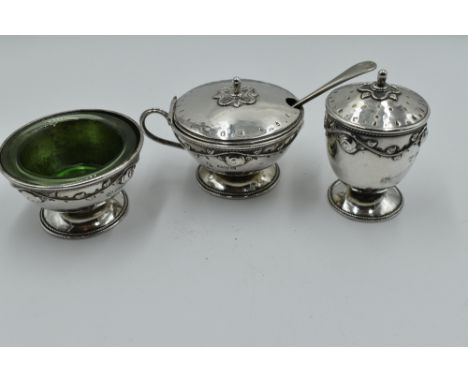 A three piece silver cruet set of Artisan style having silver wire and rose appliqué decoration, Chester 1920, Harold Edwin L