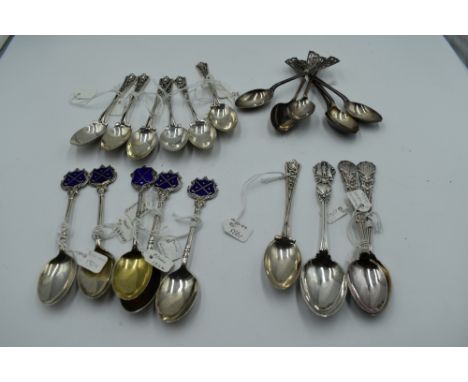 A selection of HM silver teaspoons, most of golf interest including enamelled terminals and pierced stems, approx 21 &amp; 28