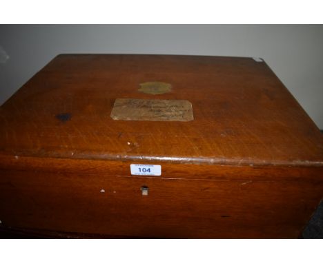 A large wooden canteen with inner tray containing a selection of silver plated ware including flatware, ladles, napkin rings,