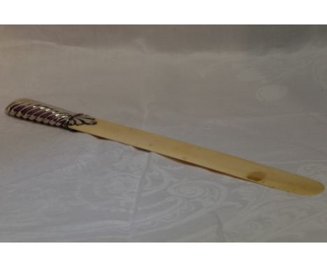 A Victorian silver page turner bearing monogram and date to blade and having moulded handle, London 1887, William Lund &amp; 