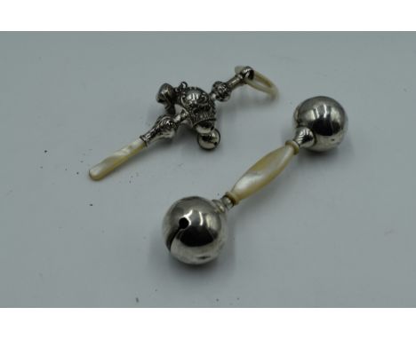 A baby's silver rattle having four bells, mother of pearl teething ring and handle, Birmingham 1919, Cornelius Desormeaux Sau
