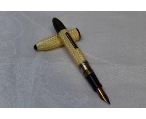 A Conway Stewart Dinky style white metal fountain pen stamped sterling having pale yellow guilloche enamelled decoration and 