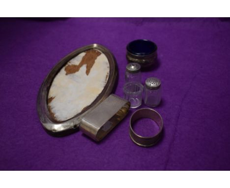 A small selection of HM silver and white metal stamped Sterling including glass pepperettes, napkin rings, salt with blue gla