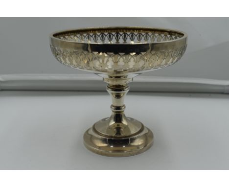 A silver tazza having pierced decoration and pedestal foot, Birmingham 1914, makers marks worn, possibly Jones &amp; Crompton