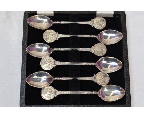 A set of six HM silver teaspoons having moulded golf scenes to terminals, various Birmingham hallmark dates in 1960/70's, pre