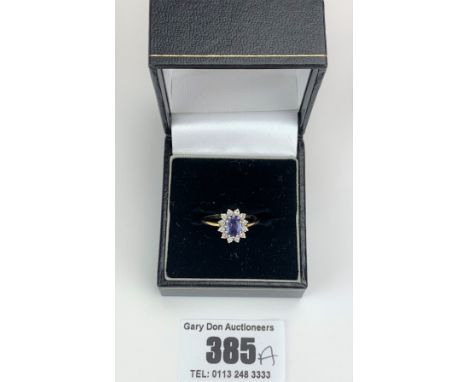 18k gold oval shaped tanzanite and diamond cluster ring, size M, w: 2.8 gms