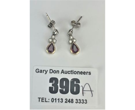 Pair of 18k gold ruby and diamond drop earrings, w: 1.5 gms