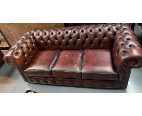 Oxblood Chesterfield 3 seater sofa.28"H  X79"W X 34"D