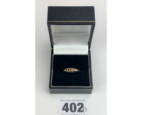Unmarked gold ring with red/white stones (2 stones missing), engraved inside ACM-MM 8-12-27, size Q, w: 3 gms