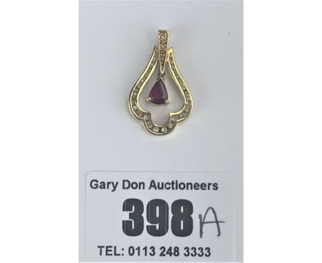 18k gold openwork drop ruby and diamond pendant, length 1", w: 2.3 gms