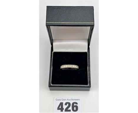 Unmarked white gold diamond eternity ring, size O, w: 2.4 gms