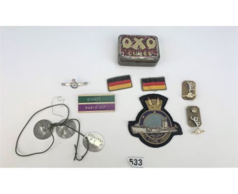 Oxo tin with 3 dog tags L.J. Dicker, name badge, Military pin badge, cap badges, Royal Naval Submarine patch and 2 German pat