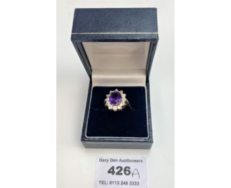 9k gold purple and white stone oval cluster ring, size N, w: 3.7 gms