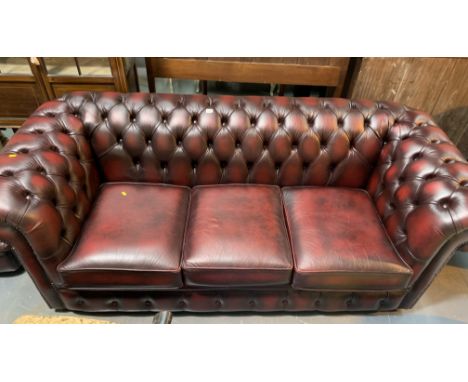 Oxblood Chesterfield 3 seater sofa.28"H  X79"W X 34"D