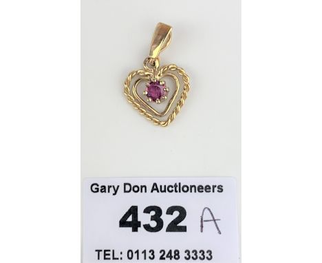 9k gold and ruby heart shaped pendant, length 1", w: 1.5 gms