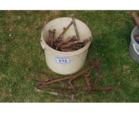 A bucket of gate fixings.