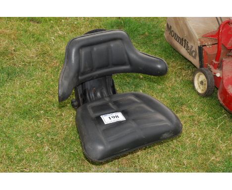 A sprung wrap around tractor seat.