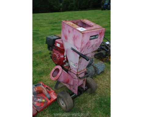 A Titan 14 hp Shredder with overhead valve Honda style engine with self-starter. (unable to start as no fuel present).