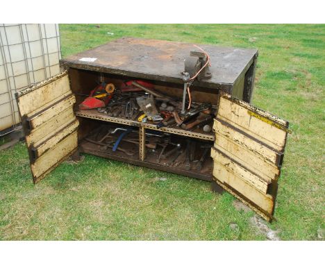 A steel welding bench and vice, 49'' x 39 1/2'' x 32 1/2'', plus a large quantity of tools within.