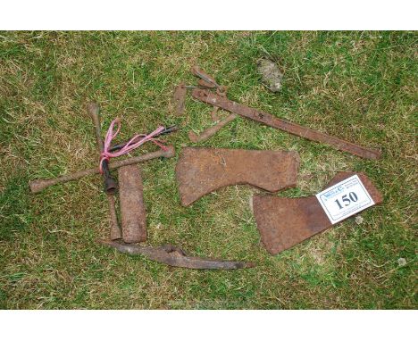 2 axe heads, sledge hammer head, spider wrench and fence tensioner.
