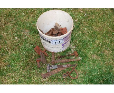 A bucket of gate fixings.