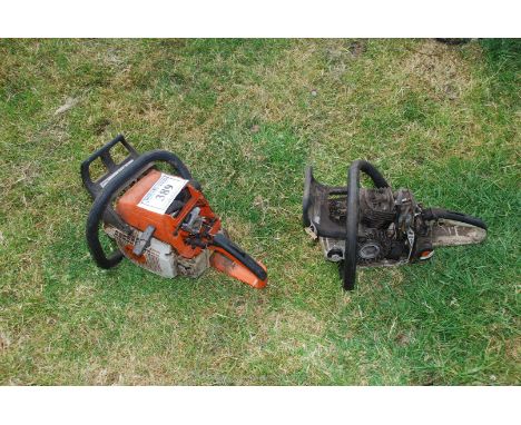 An MS 310 chainsaw engine plus one for repairs. (unable to start, no fuel present).