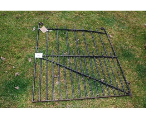 A wrought iron garden gate.
