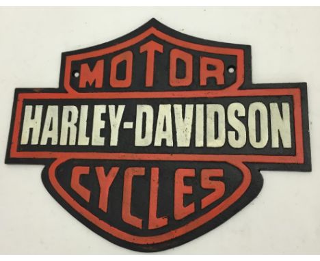 A cast-iron 'Harley Davidson' sign