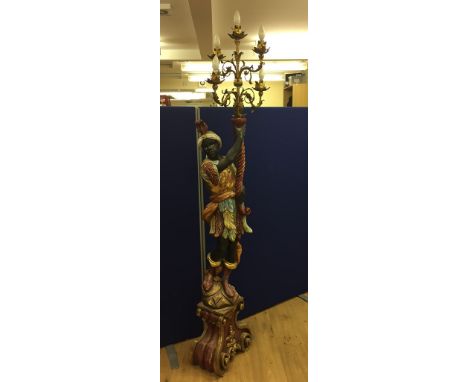 A large Blackamoor figure candelabra