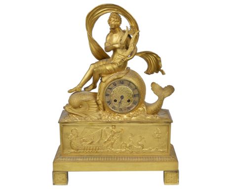 A 19th century French ormolu mantel clock:
Gilded case of Arion playing a lyre, seated on a dolphin, beneath a plaque of Ario