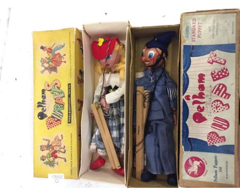 A boxed 1950s Pelham puppet (policeman); together with one other