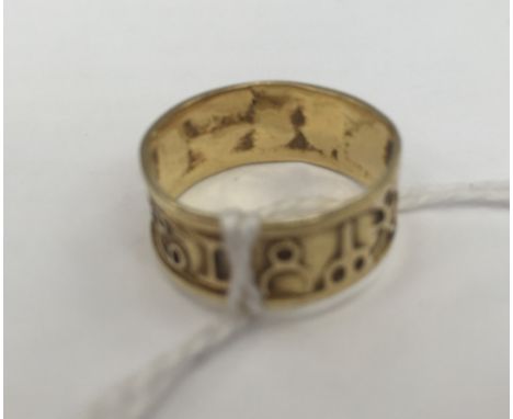 A gold Zodiac sign ring