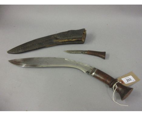 Antique wooden handled kukri having leather scabbard with one additional shorter knife, lacking two others