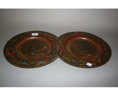 Two Middle Eastern circular copper plates enamel decorated with peacocks
