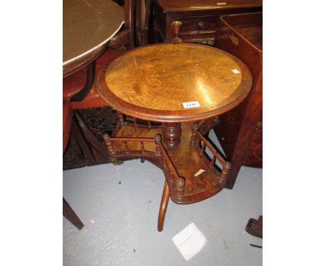 Victorian walnut reading table, the circular top with candle bracket above galleried book tier raised on tripod supports