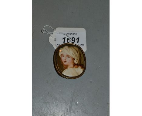 Small 19th Century watercolour, portrait miniature on ivory of a girl wearing a linen headdress, mounted as a mourning brooch