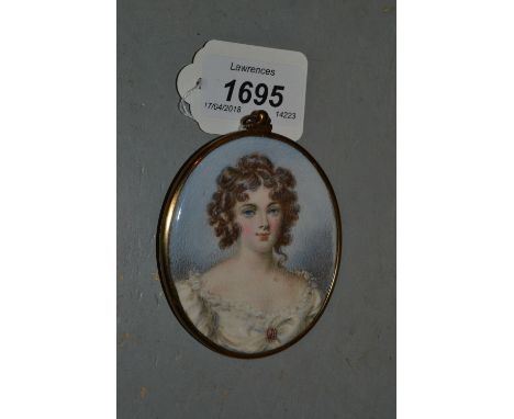 19th Century watercolour, portrait miniature on ivory of a girl, her hair in ringlets wearing a garnet and pearl brooch, 3ins