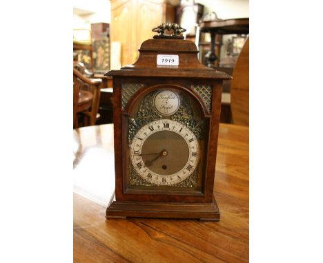 Reproduction figured walnut bracket clock in Georgian style, the silvered and brass dial inscribed Tempest Fugit, with a sing