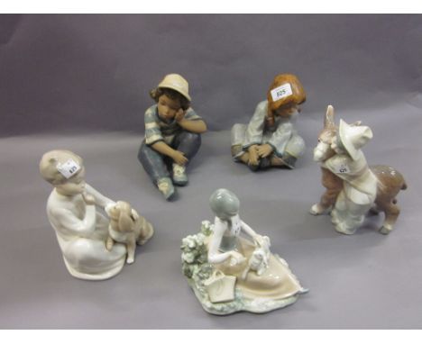 Pair of Lladro matt glazed figures of seated children (seconds - one at fault), together with a Lladro figure of a boy and do