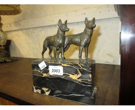 Pair of early 20th Century bronze figures of dogs mounted on a marble plinth (unsigned), 7ins wide x 8ins high