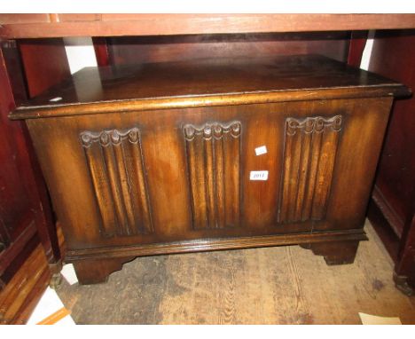 Small reproduction oak coffer with a linen fold panel front together with a small reproduction oak refectory style dining tab