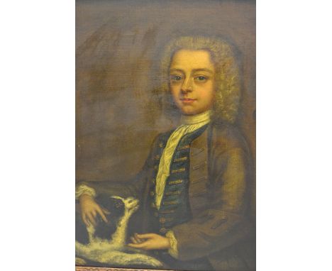 18th Century oil on canvas, half length portrait of a seated boy with a pet spaniel, 29ins x 24ins, housed in original gilt f