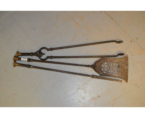 Set of three good quality steel and brass mounted fire tools