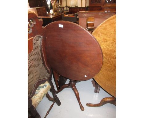 George III circular mahogany pedestal bird cage table on turned column and tripod support
