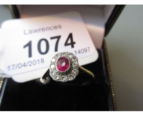 Yellow gold ruby and diamond cluster ring