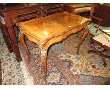 Good quality Victorian figured walnut and ormolu mounted card table, the shaped fold-over top above a shaped frieze and cabri