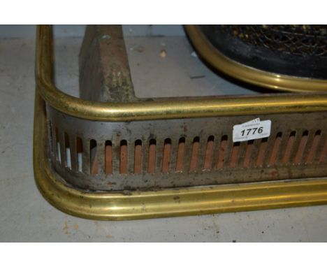 19th Century pierced brass fender, steel spark guard, pair of brass fire dogs and various fire tools