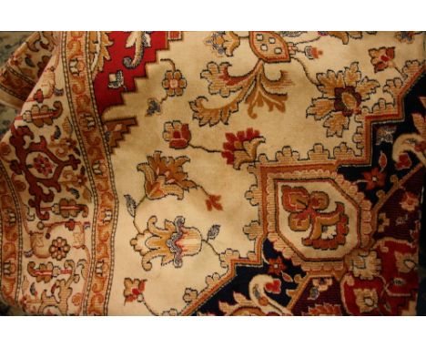 Beige ground Heriz pattern machine woven carpet, 2.30m x 1.60m