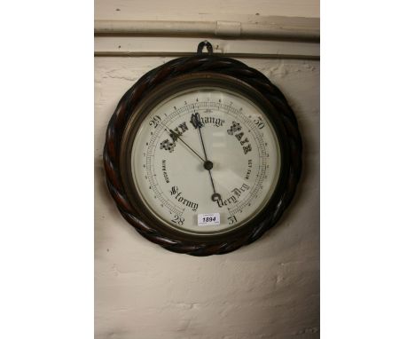 Large late 19th Century circular aneroid barometer with carved oak rope pattern border, 14.5ins diameter