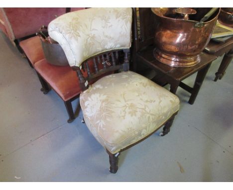 Victorian upholstered low seat nursing chair with spindle back and turned front supports, together with an oak framed cheval 